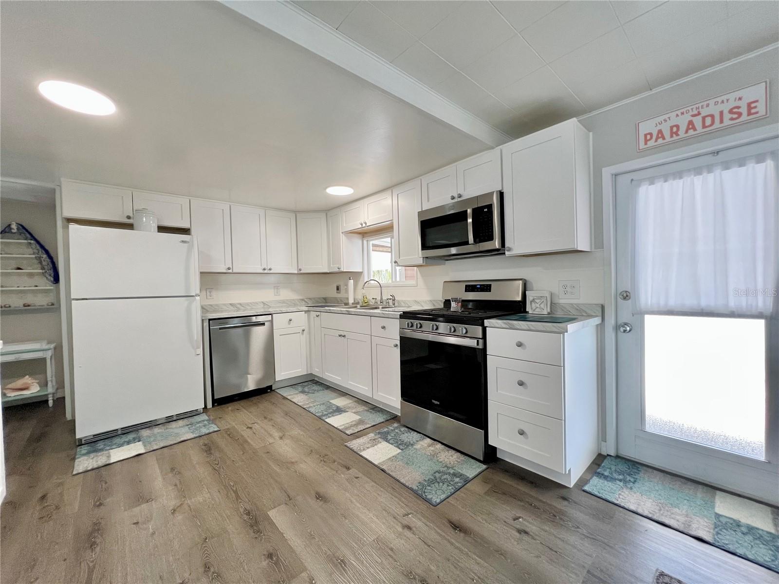 Kitchen with updated gas stove and dishwasher