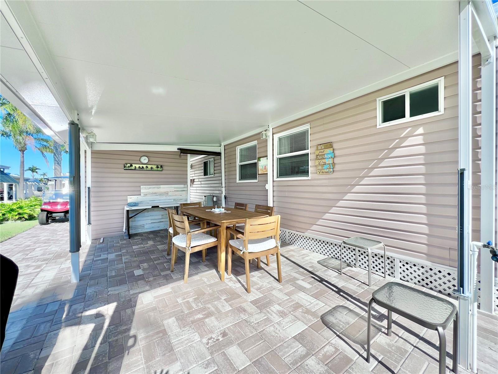 Large Back paved patio behind the shed