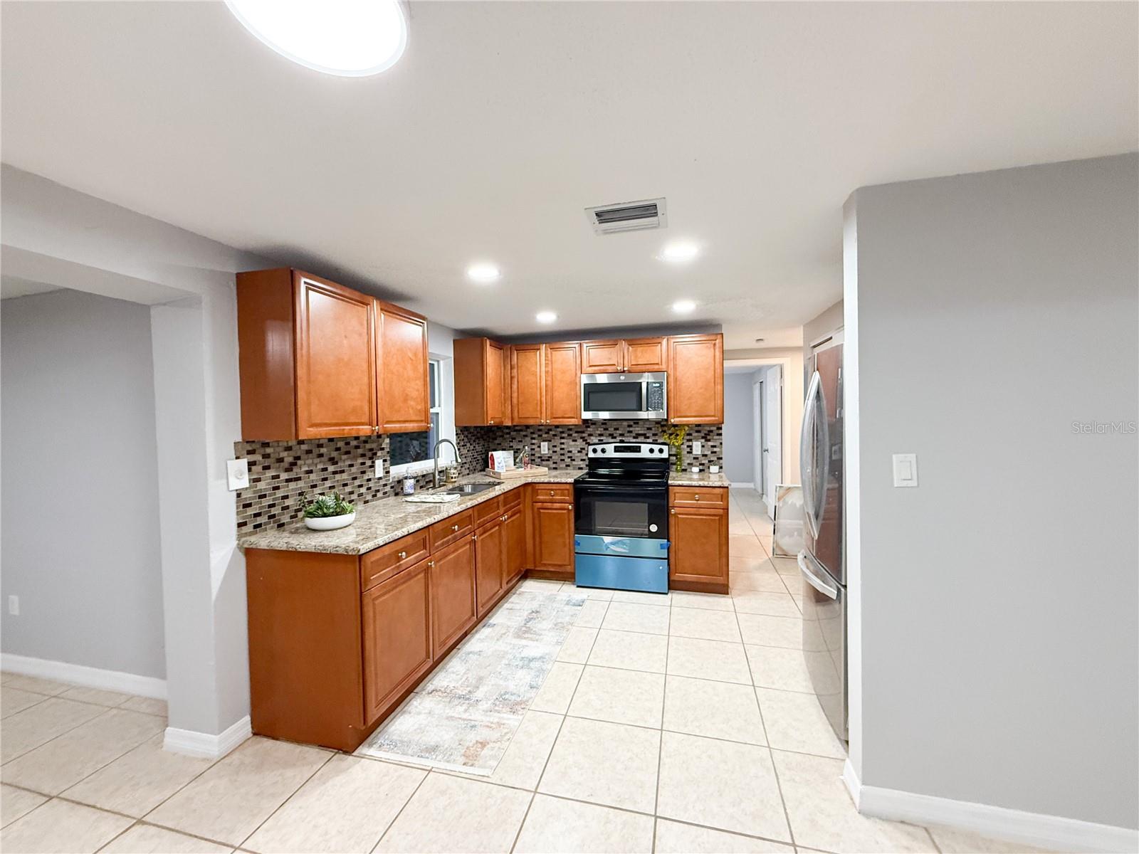 Kitchen with Granite and SS Appliances