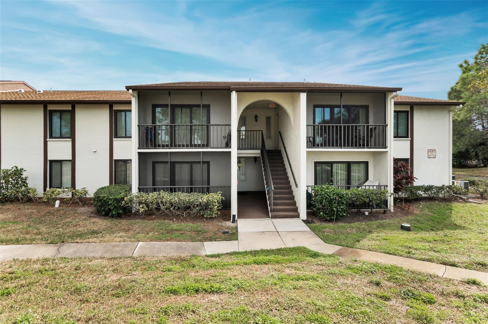 Exterior Building, unit on left side of stairs