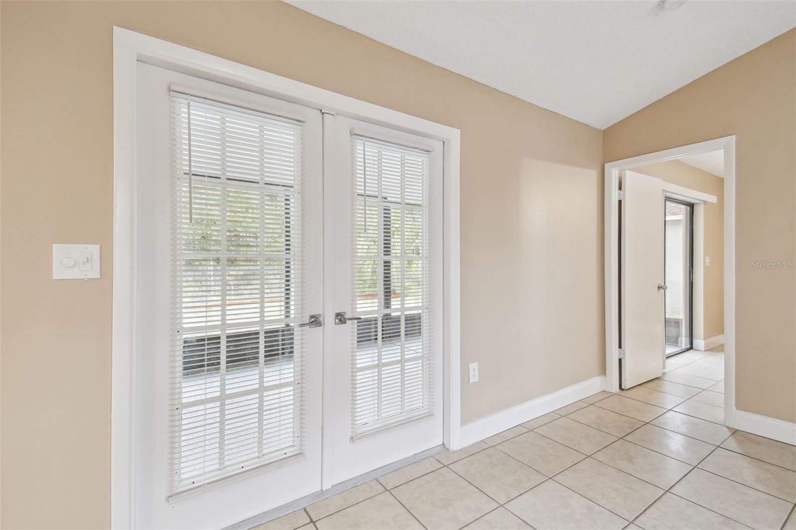 French doors to screen enclosed back porch