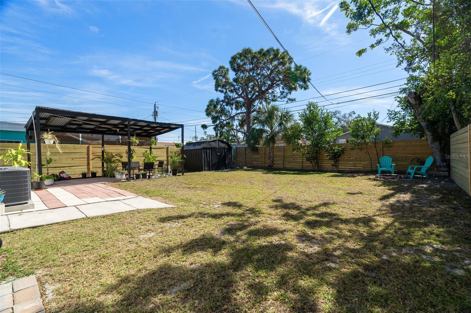 A spacious backyard designed for relaxation or entertaining.