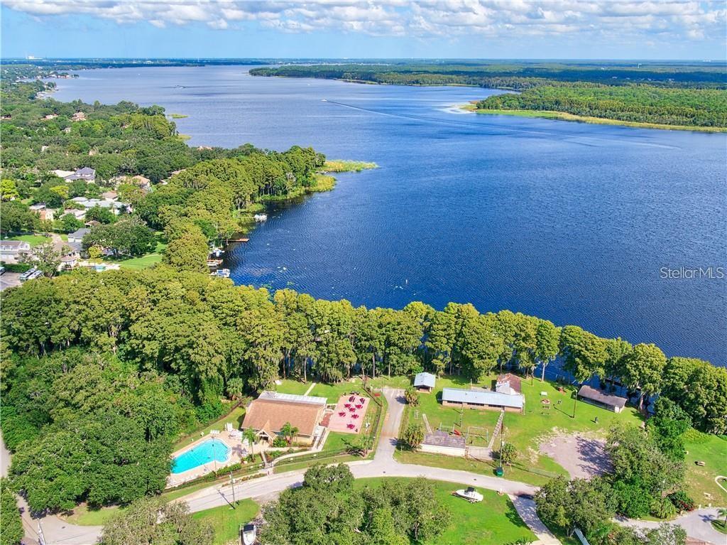 Lake Tarpon lakefront clubhouse, with pool, outdoor patios