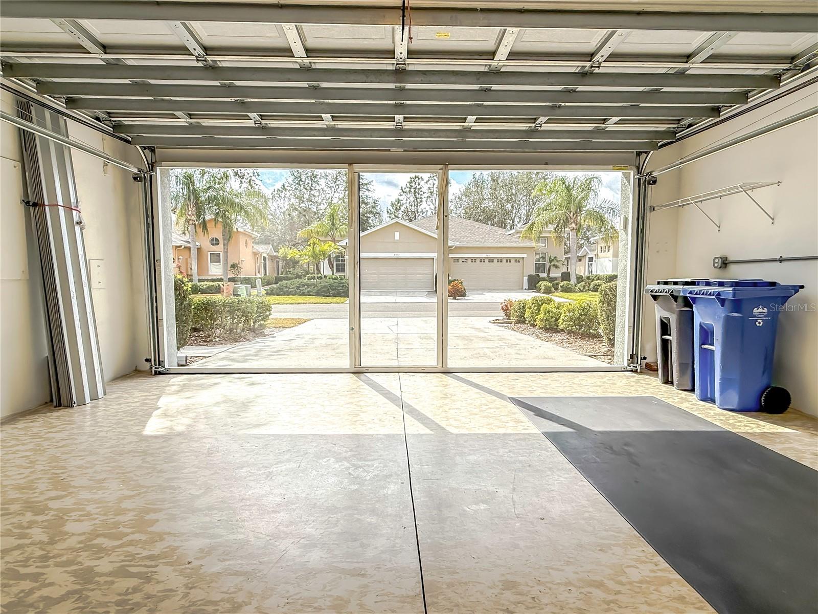 Garage with 240v and 110v outlets to charge and EV car! Hurricane shutters for the Florida room.