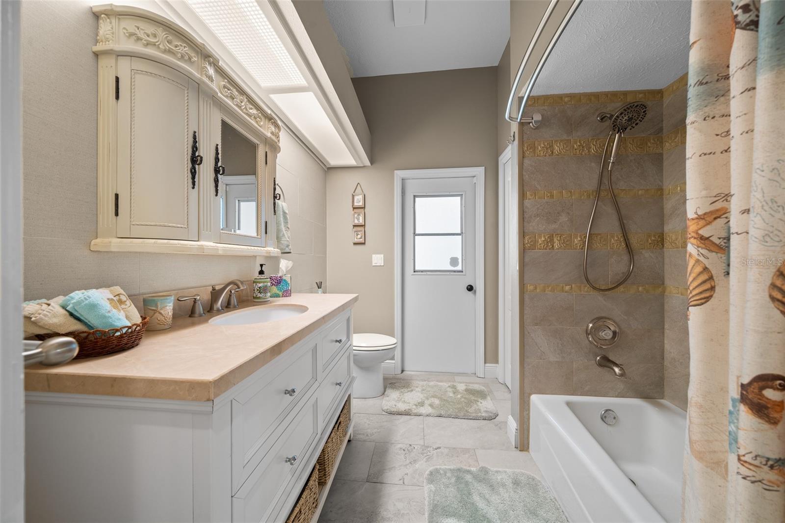 guest bathroom with pool entry door