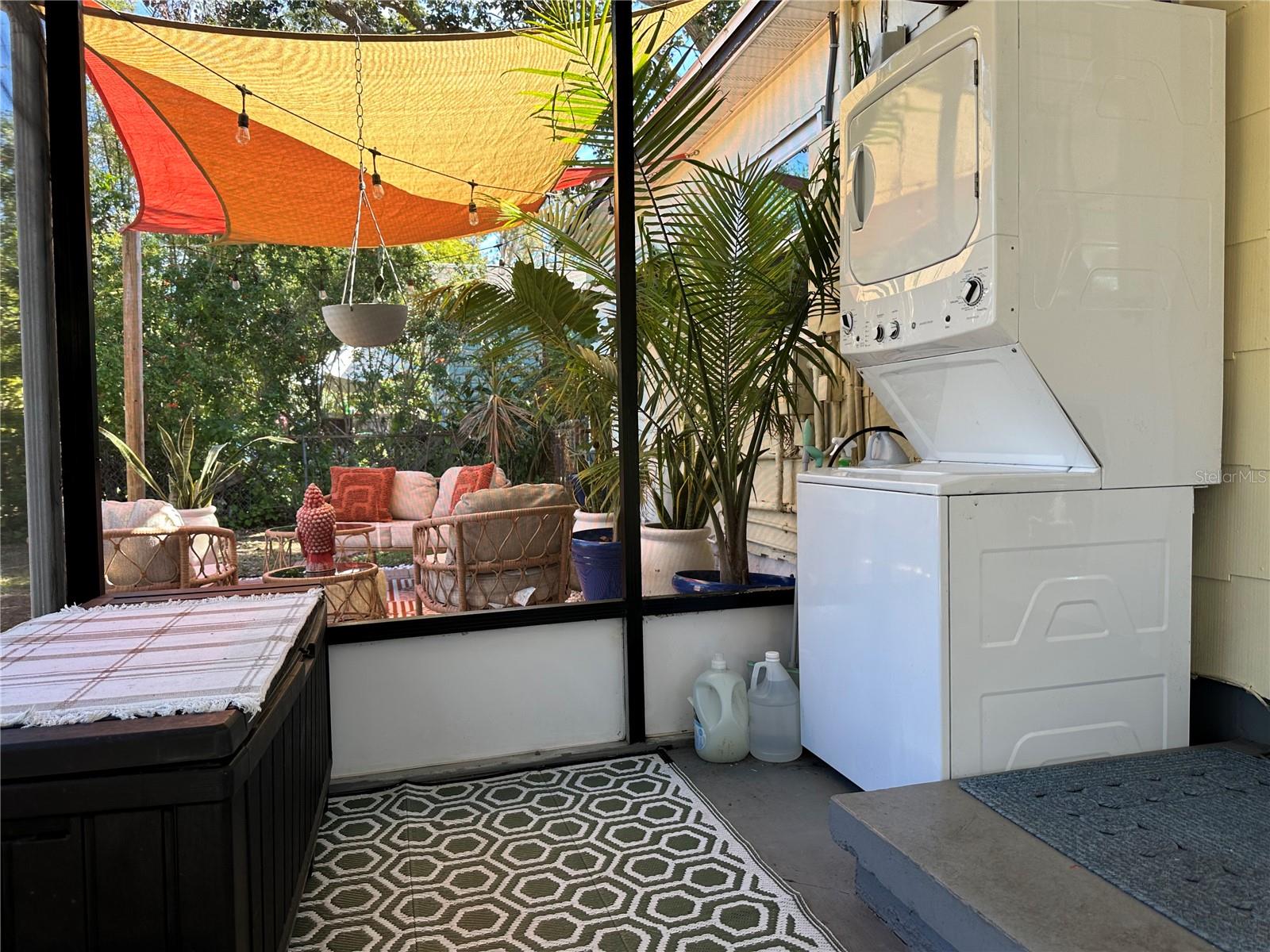 Screen porch view of laundry and patio