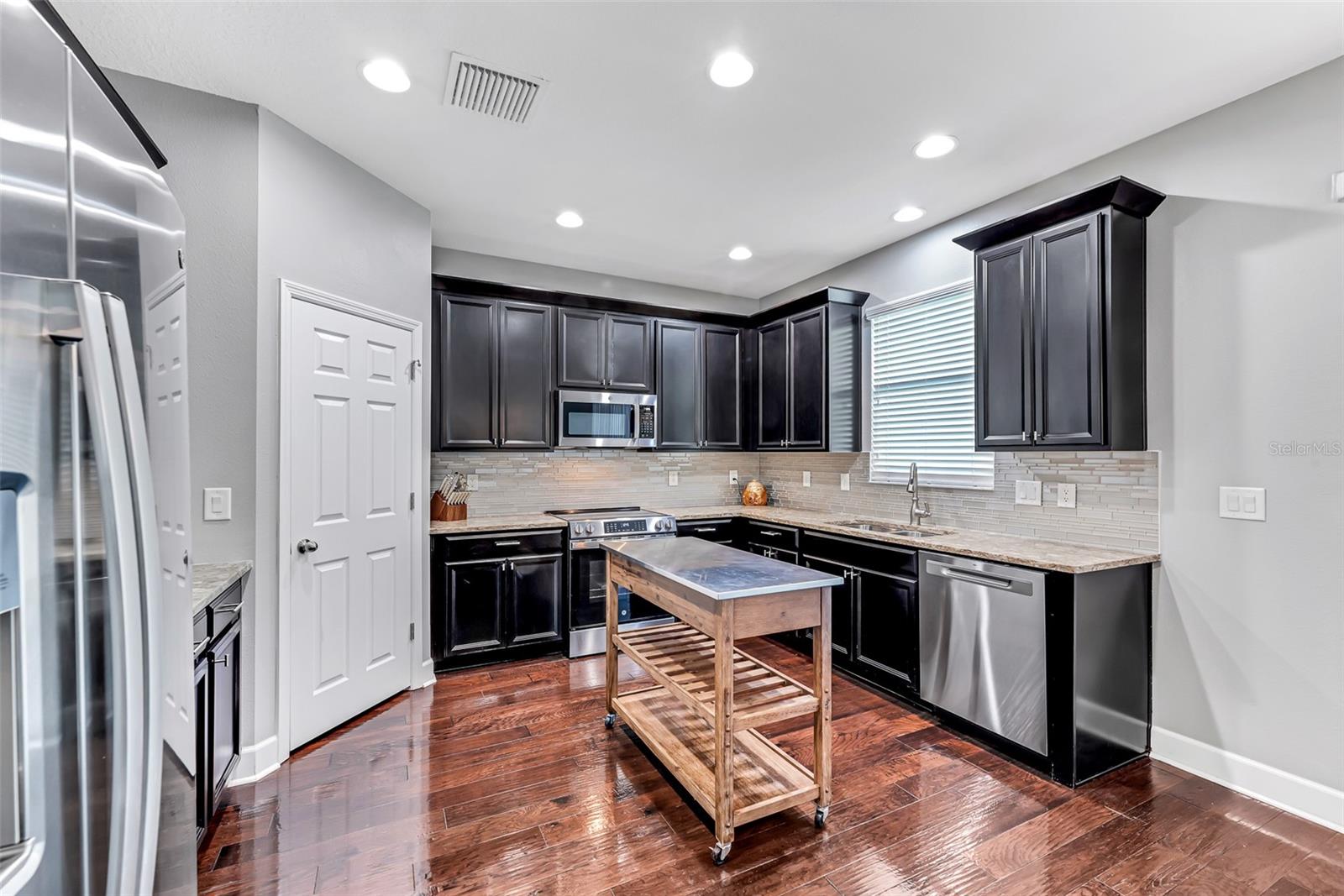 This thoughtfully designed kitchen is spacious and can easily accommodate multiple people at once.