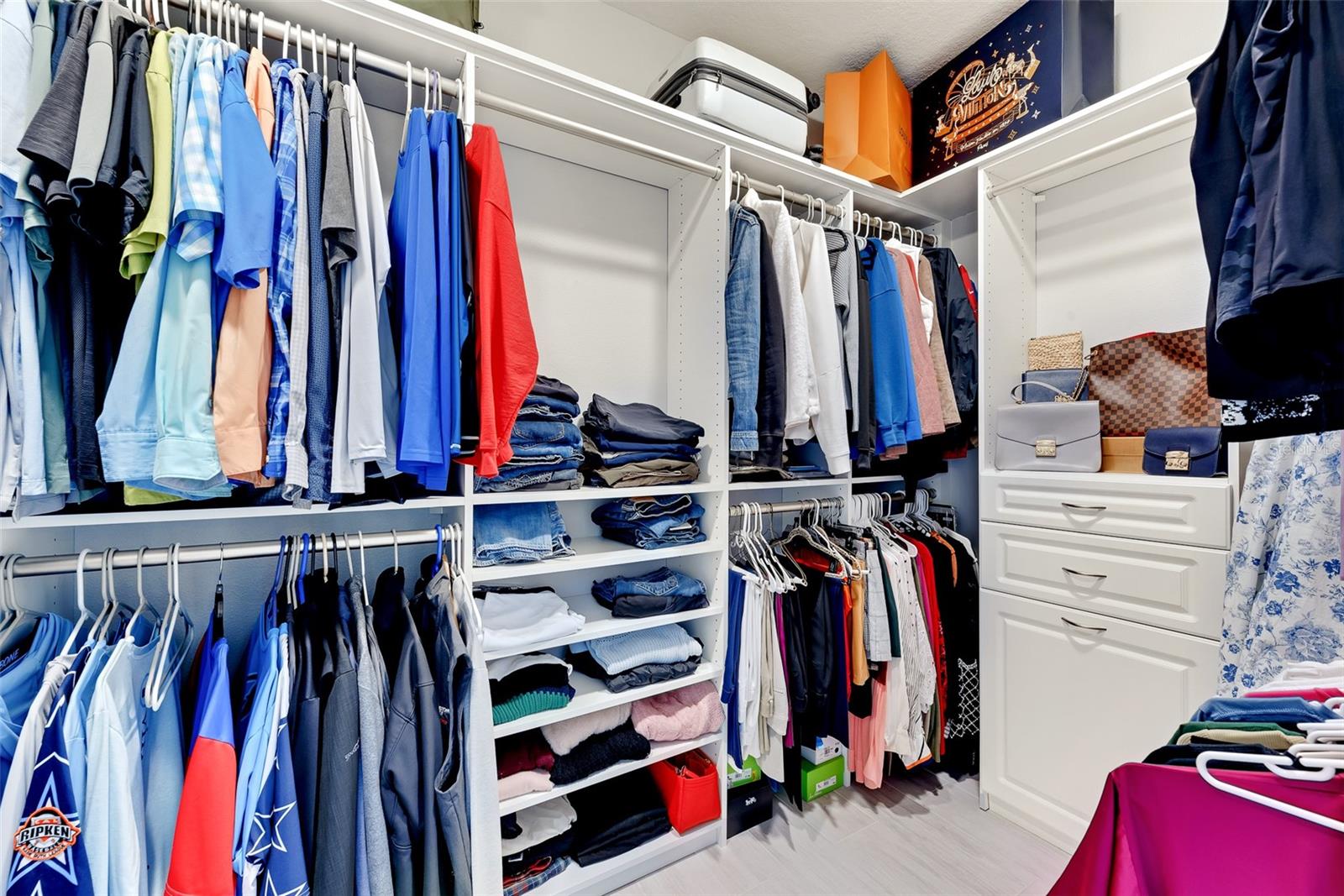 This primary closet will help you keep organized.