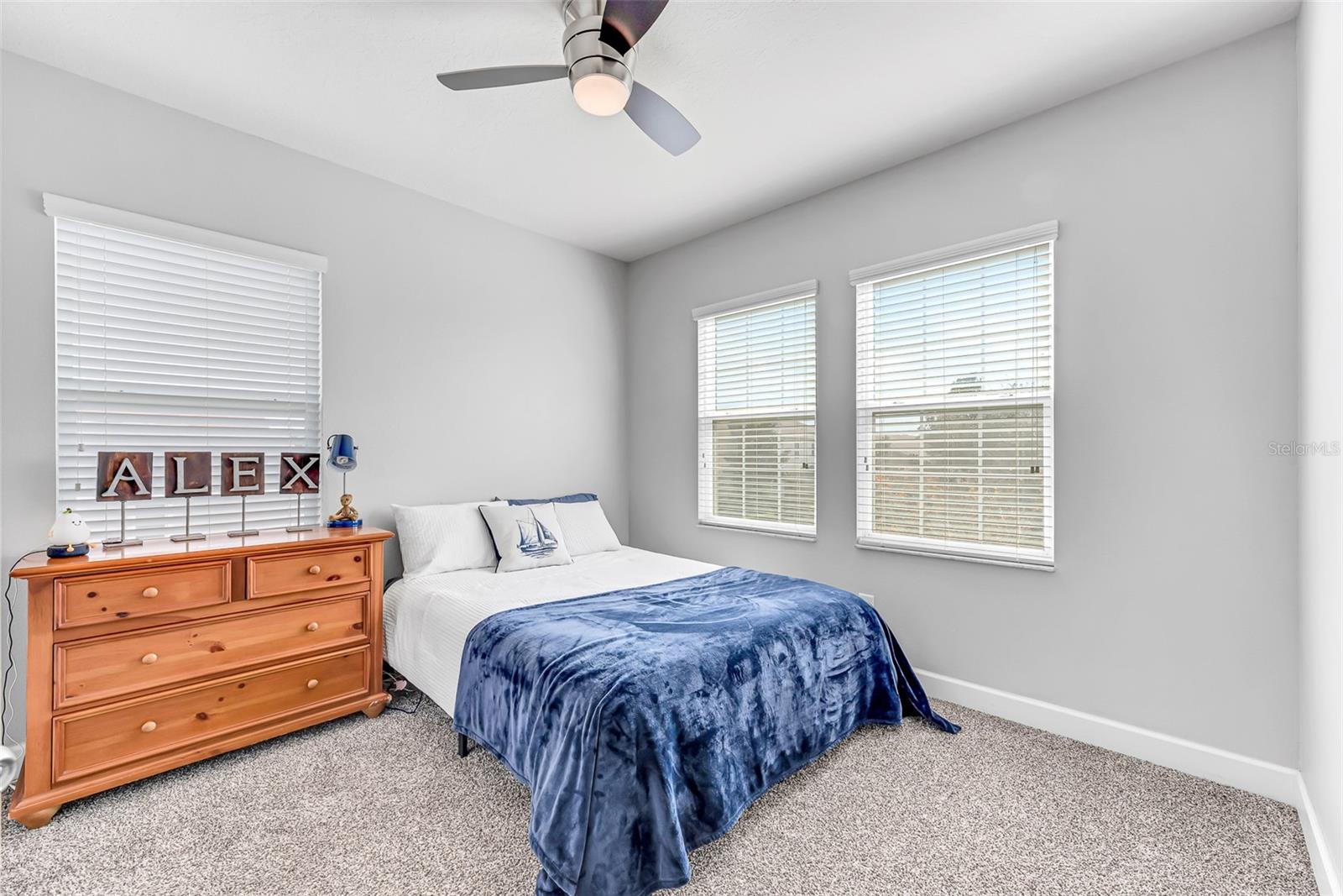 Secondary bedroom #2 on 2nd floor is 11' x 11' and has a roomy built-in closet, stylish ceiling fan and newer plush carpeting.