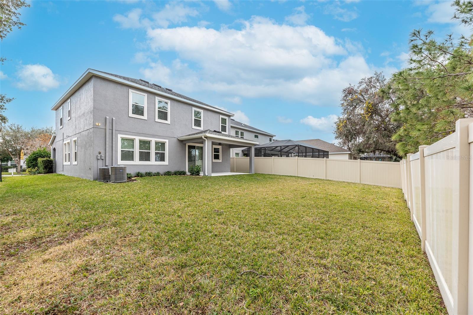 Backyard is fenced on 1 side and along the back.  Buyers will enjoy entertaining on the covered back porch.