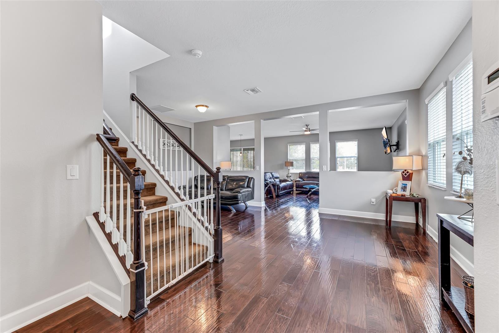 Living room is 15'x21' with sight lines to family room and backyard.  Engineered hardwood flooring recently installed throughout house as well as fresh interior paint.