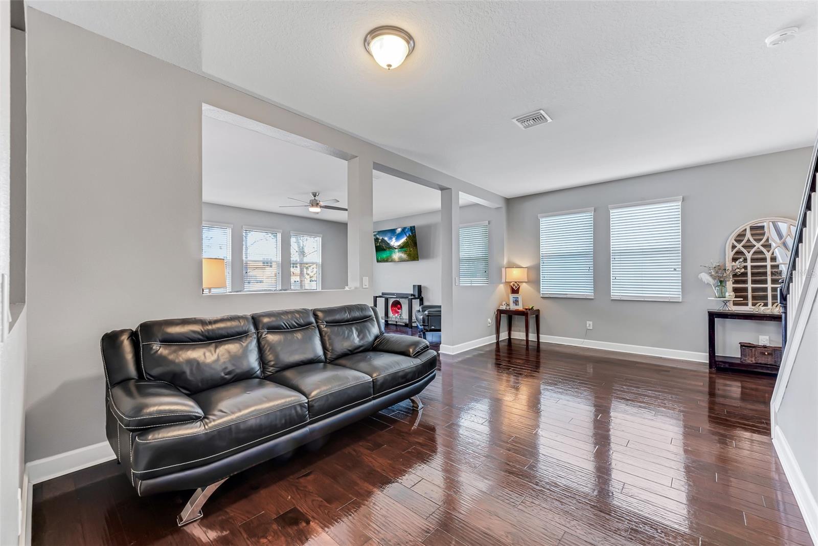 The living room has room for a formal dining table if desired.