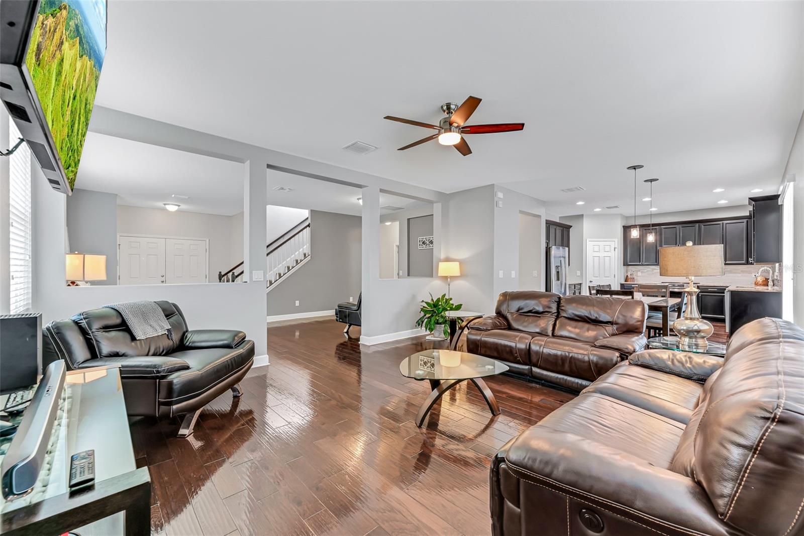 The family room flows effortlessly into the kitchen and adjacent eat-in dining area, creating an open and inviting space.