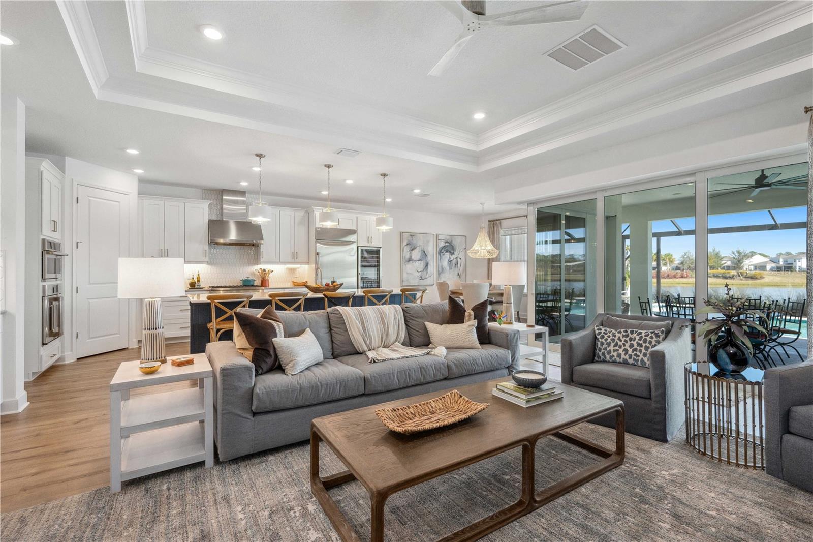 Great Room with Tray Ceiling, Custom Lighting,  and Custom Fan