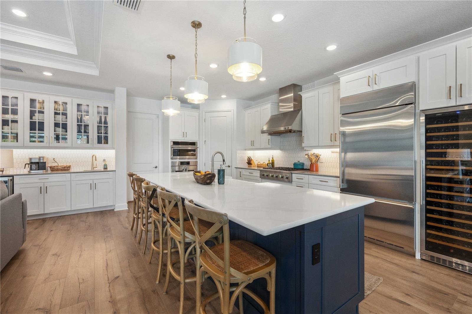 Chef's Kitchen with Stone Countertops and a Breakfast Bar