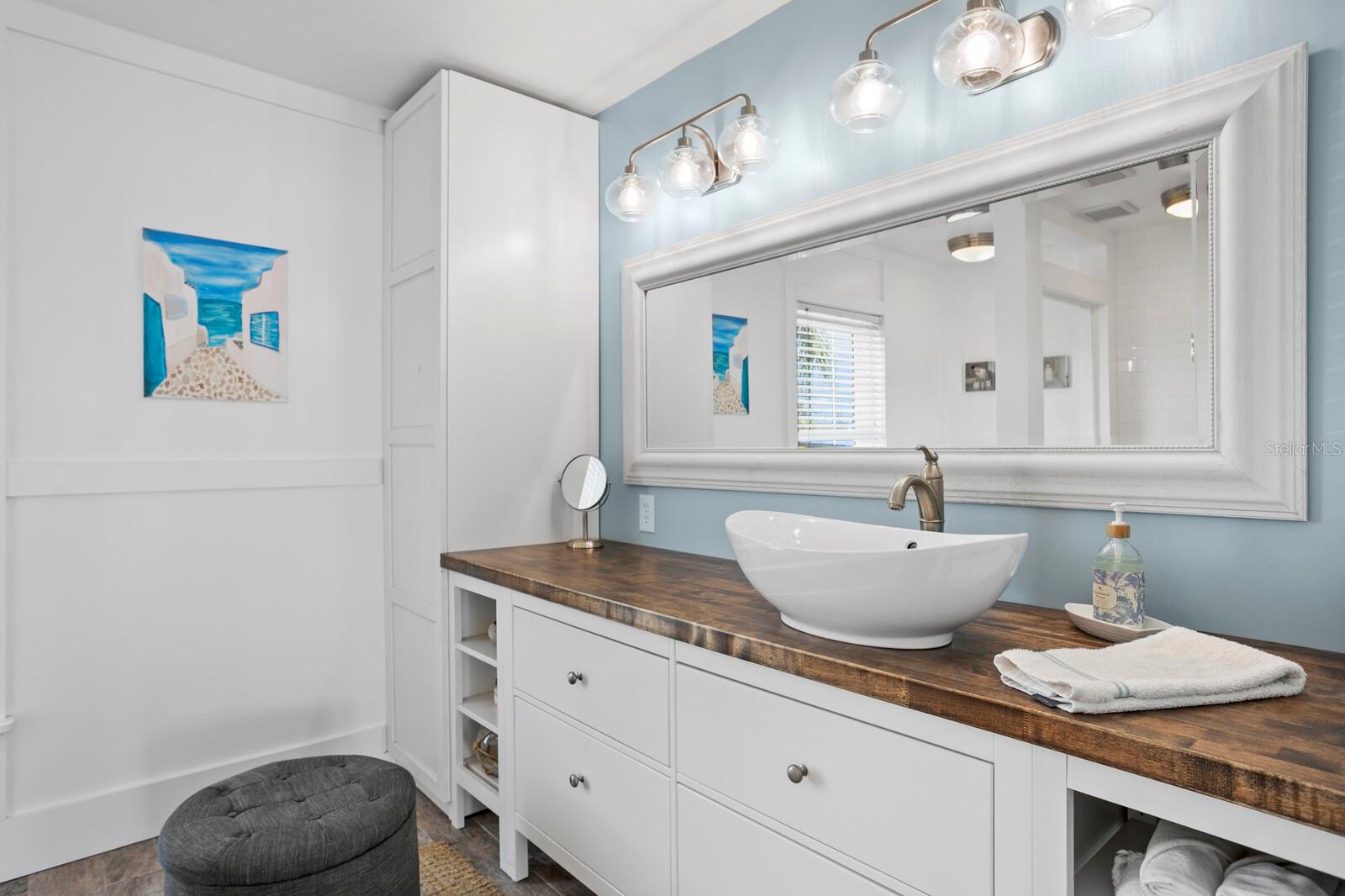 The primary bath has been fully renovated and includes a vessel sink