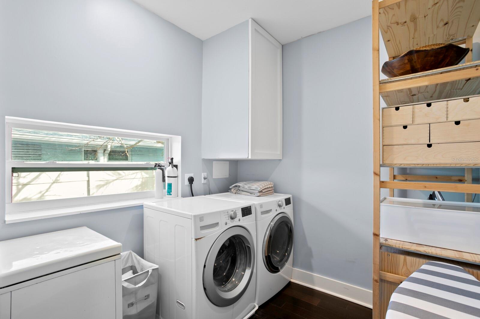 The spacious laundry room is located right off the kitchen