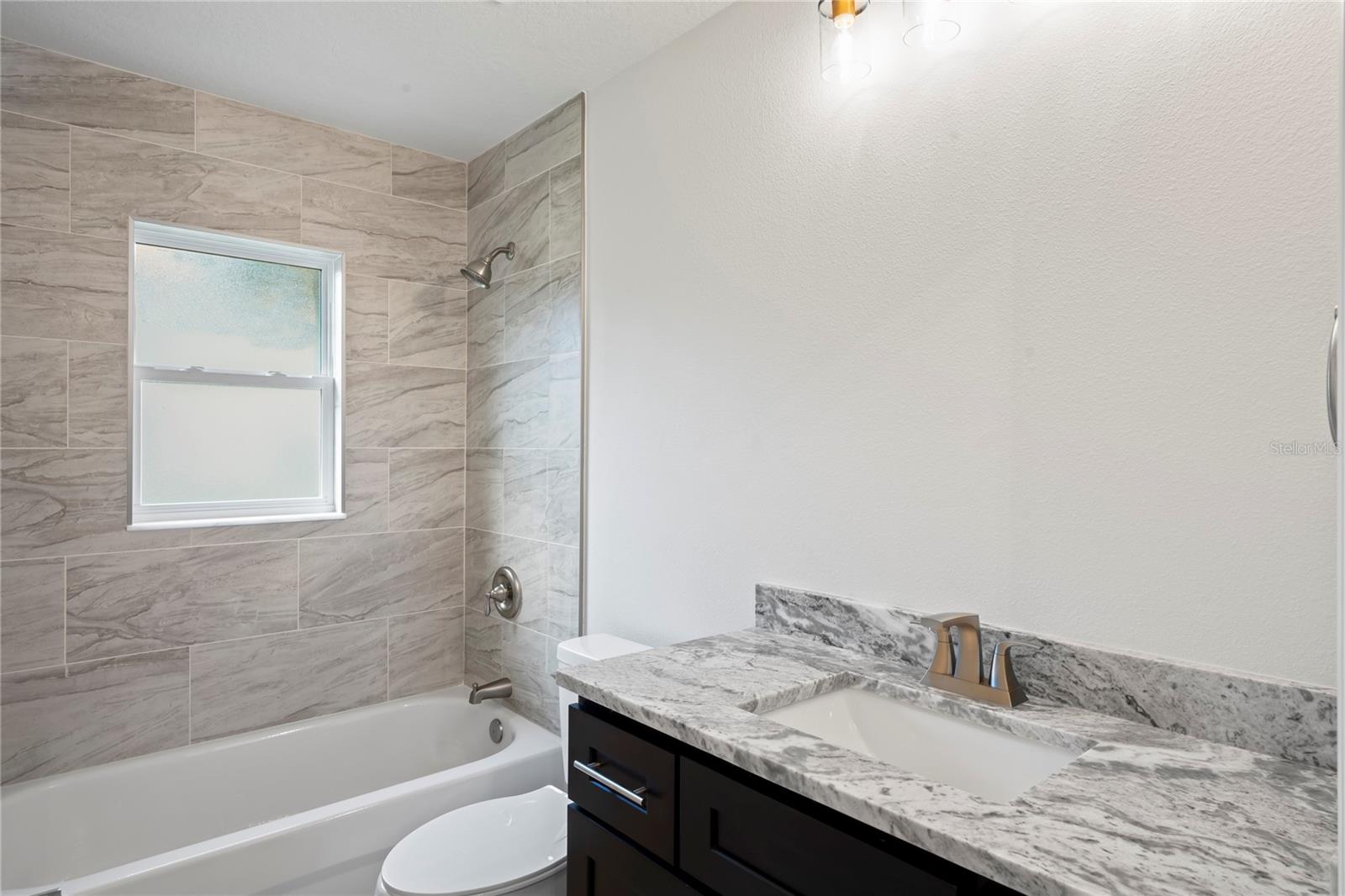 Bathroom2 Tub/Shower combo - granite counter