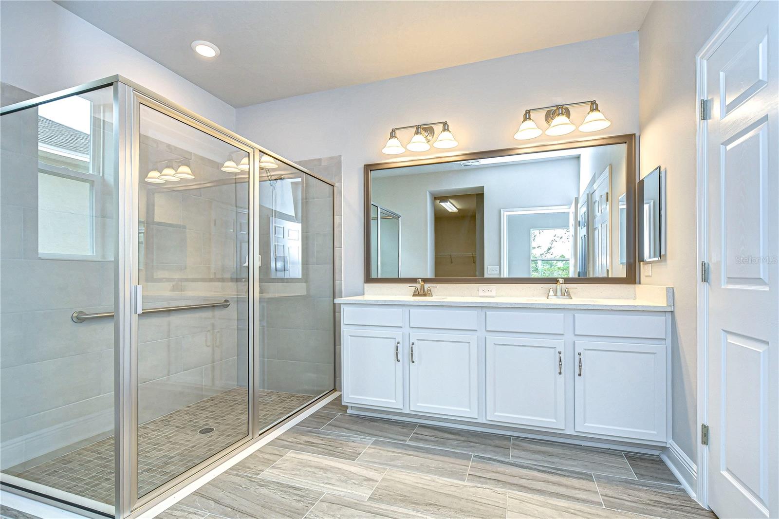 Primary bath boasts 2 dual sinks and wonderfully sized  shower!