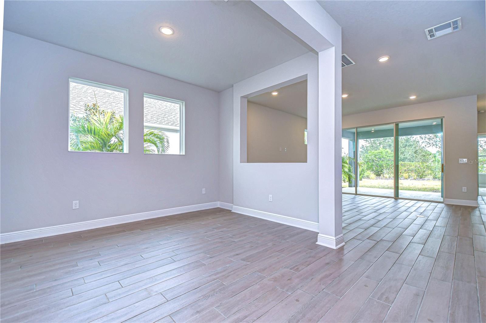 Beautiful baseboards and recessed lighting elevate the space!