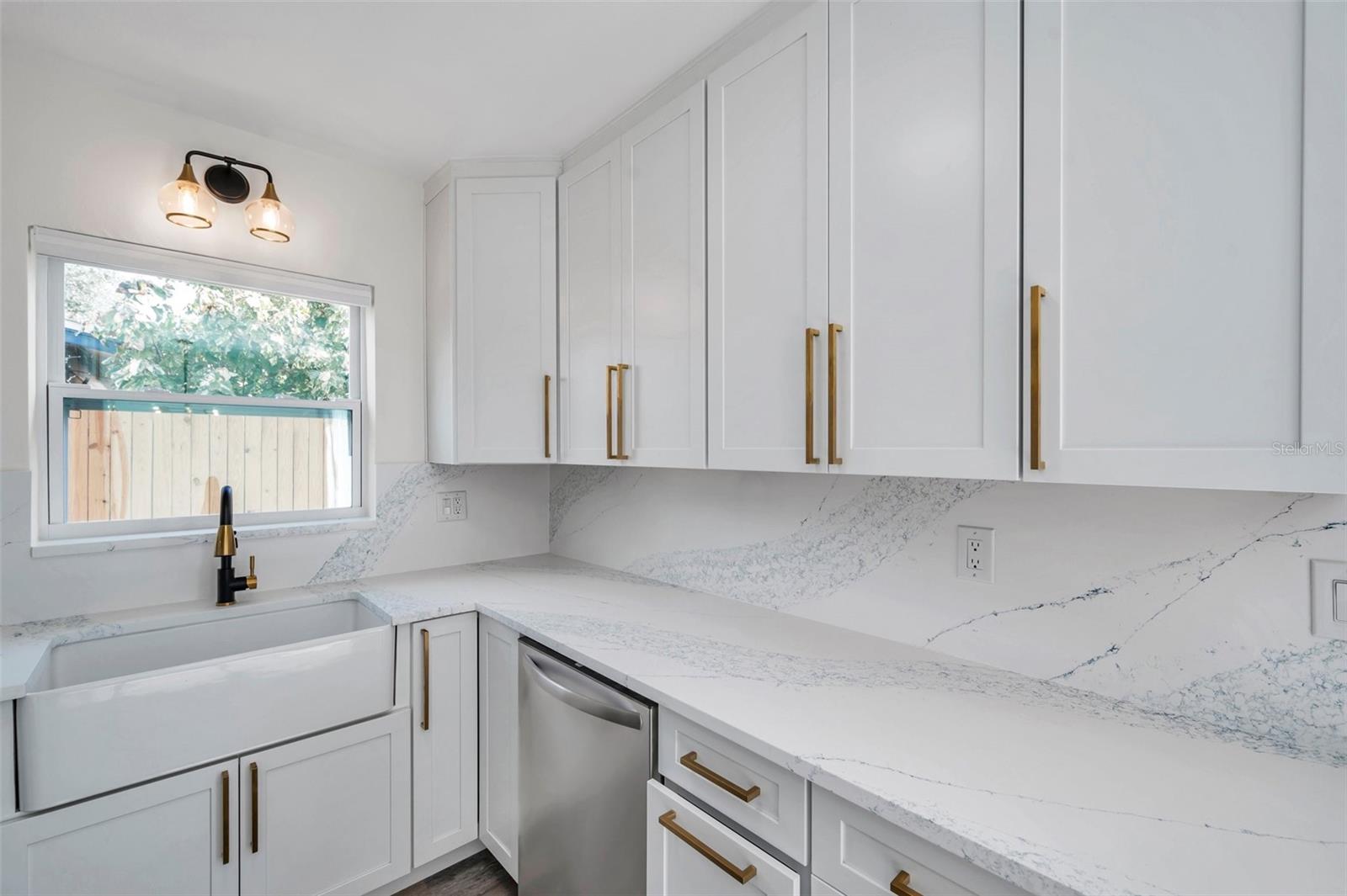 Farmhouse sink with Quartz countertops/kitchen