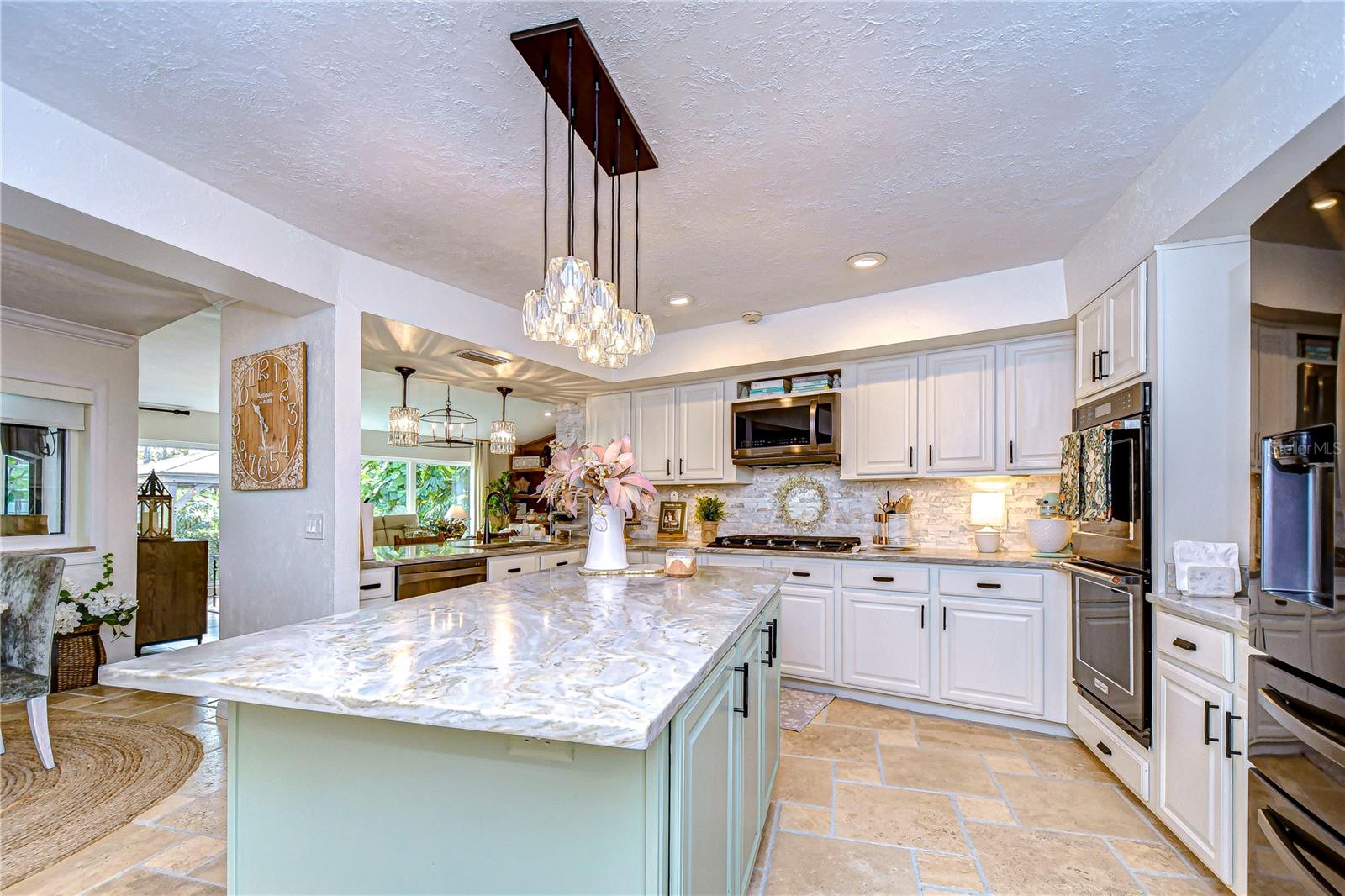 Large kitchen island provides additional space for serving or preparing your favorite meals!