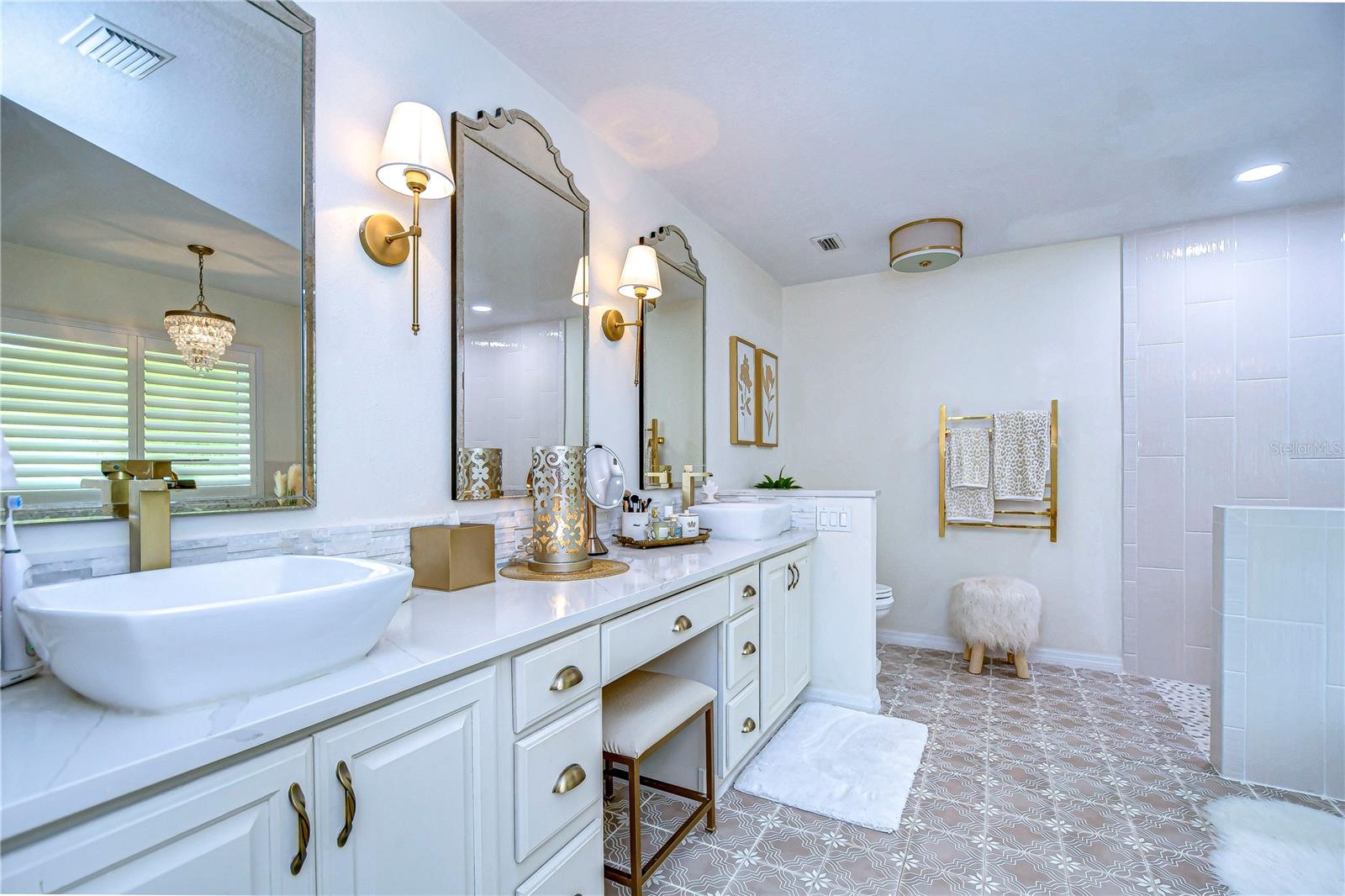 With dual sinks and separate vanity space, primary bathroom is SURE to stun!