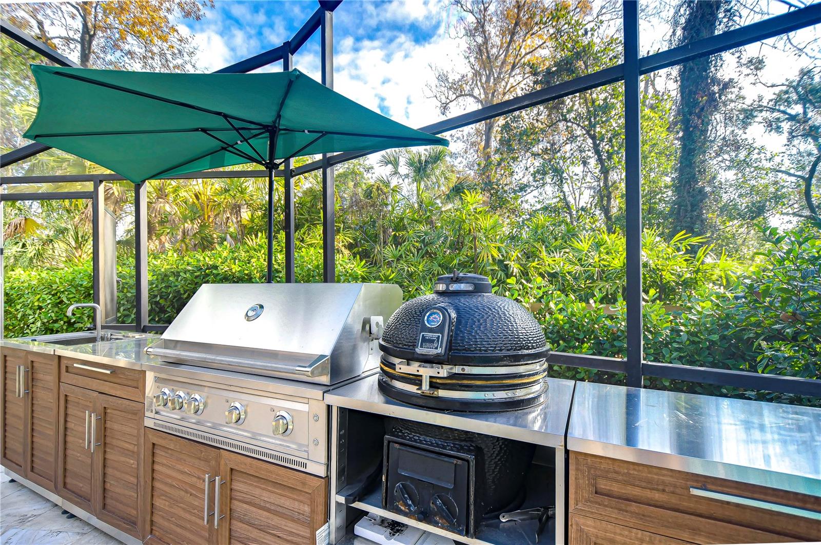 Outdoor kitchen area is perfect for pool days!