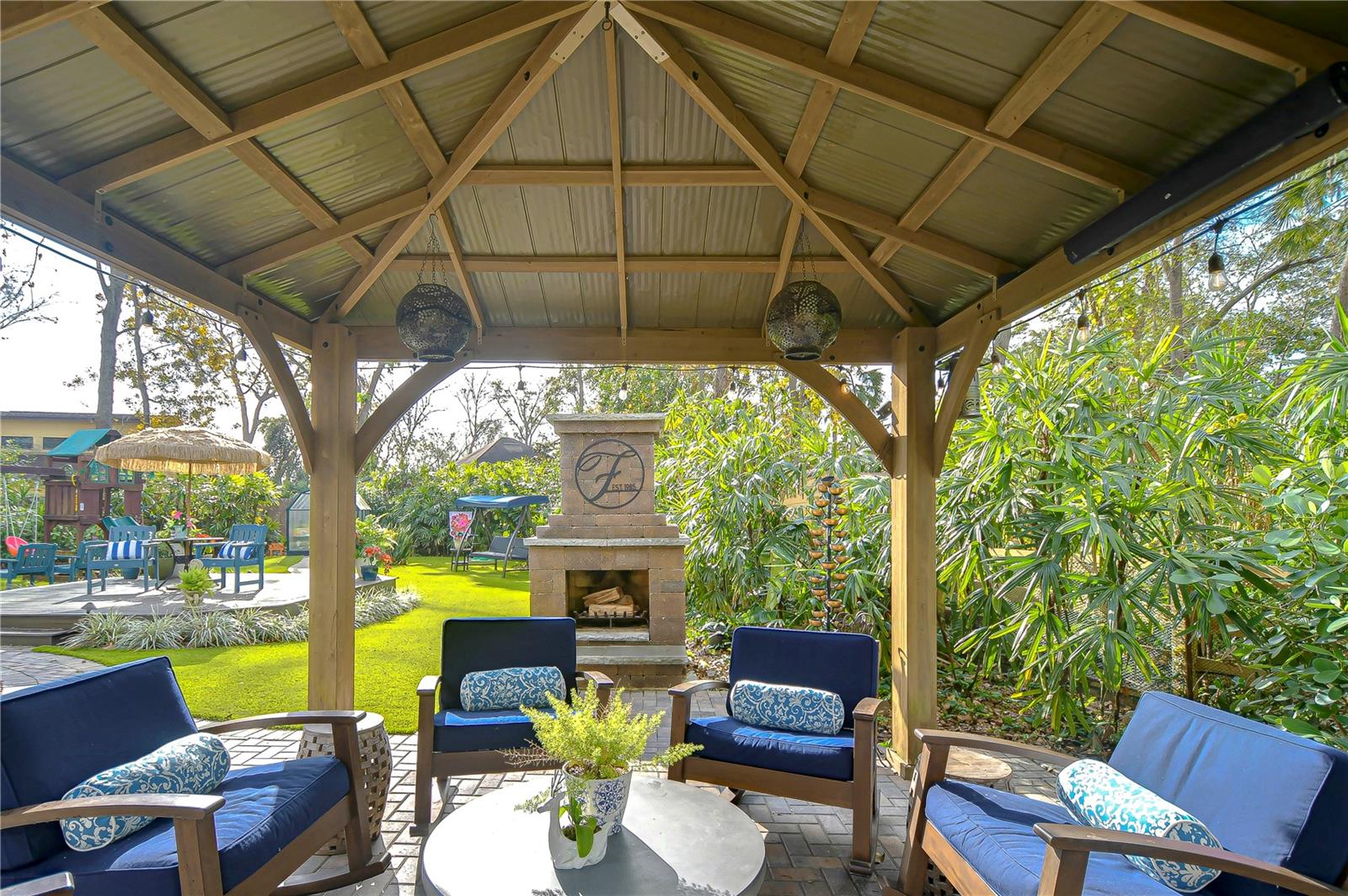 Gazebo with beautiful fireplace allows you to be surrounded by luxury as you relax.