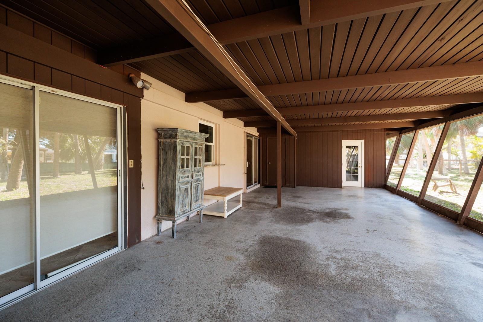 Huge screened in porch with terrazzo floors