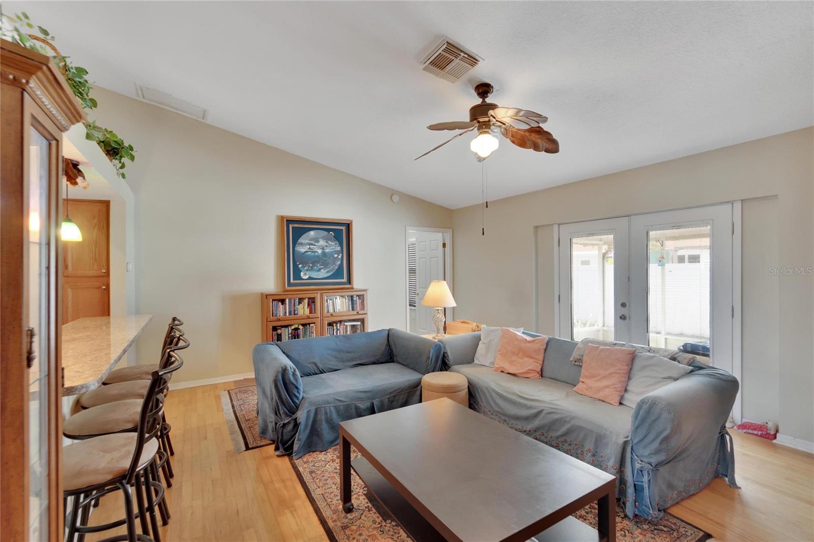 Living room With Hardwood Floors and view to back yard