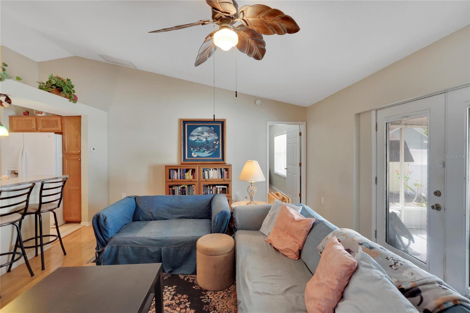 Living room With Hardwood Floors and view to back yard