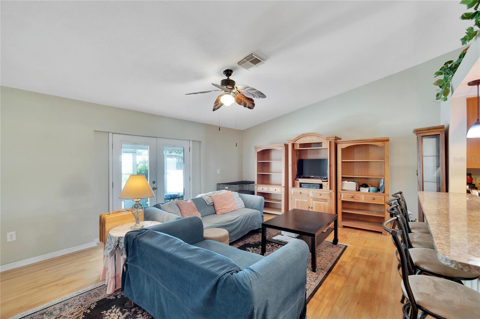 Living room With Hardwood Floors and view to back yard