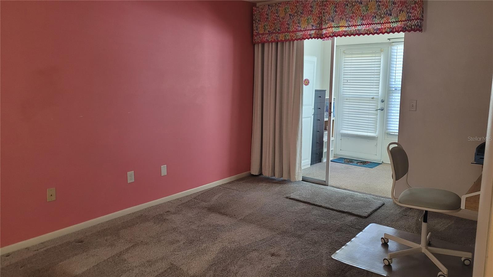 Carpeted master bedroom with access to bonus room