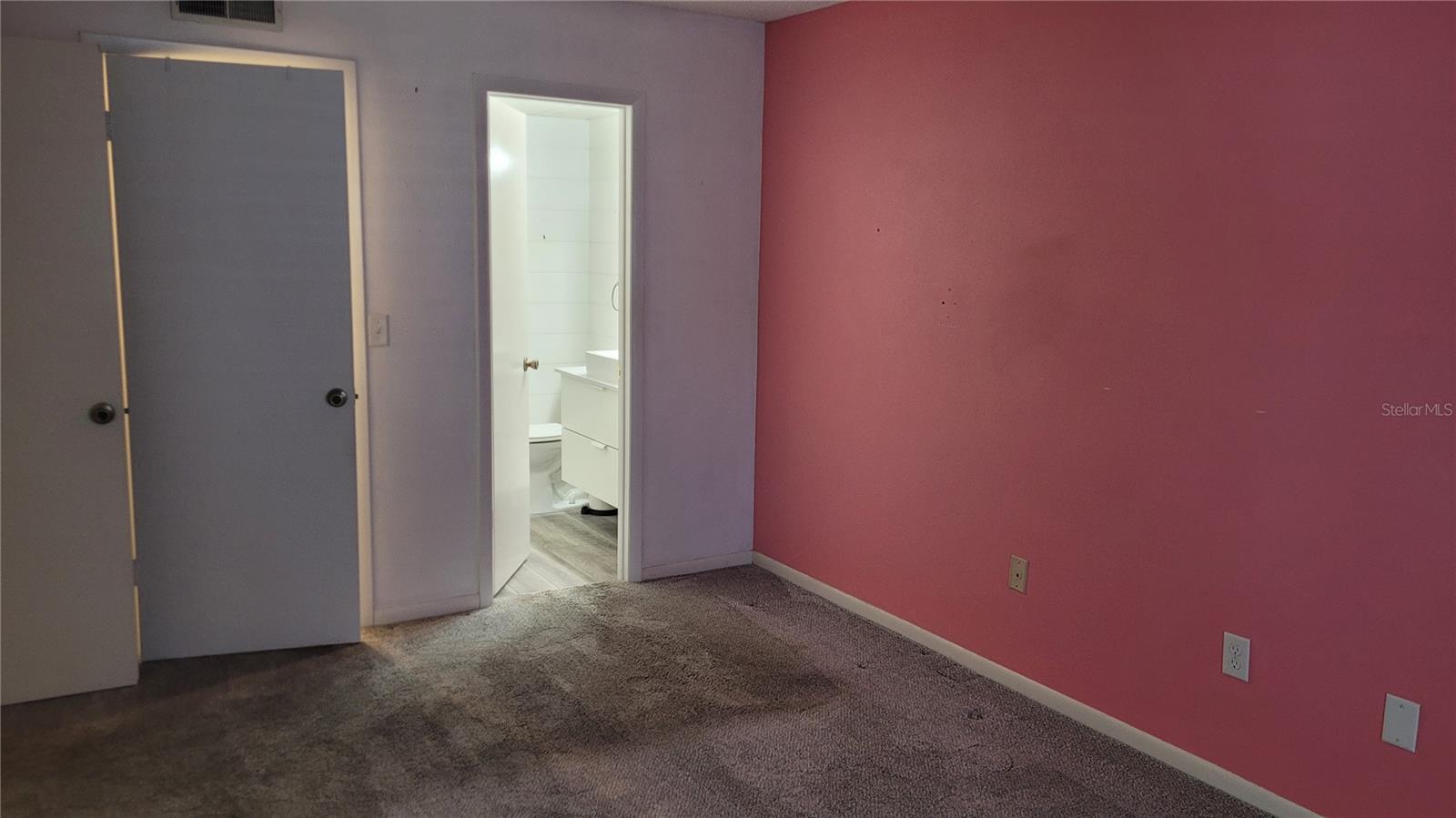 Master bedroom with ensuite bath and walk-in closet