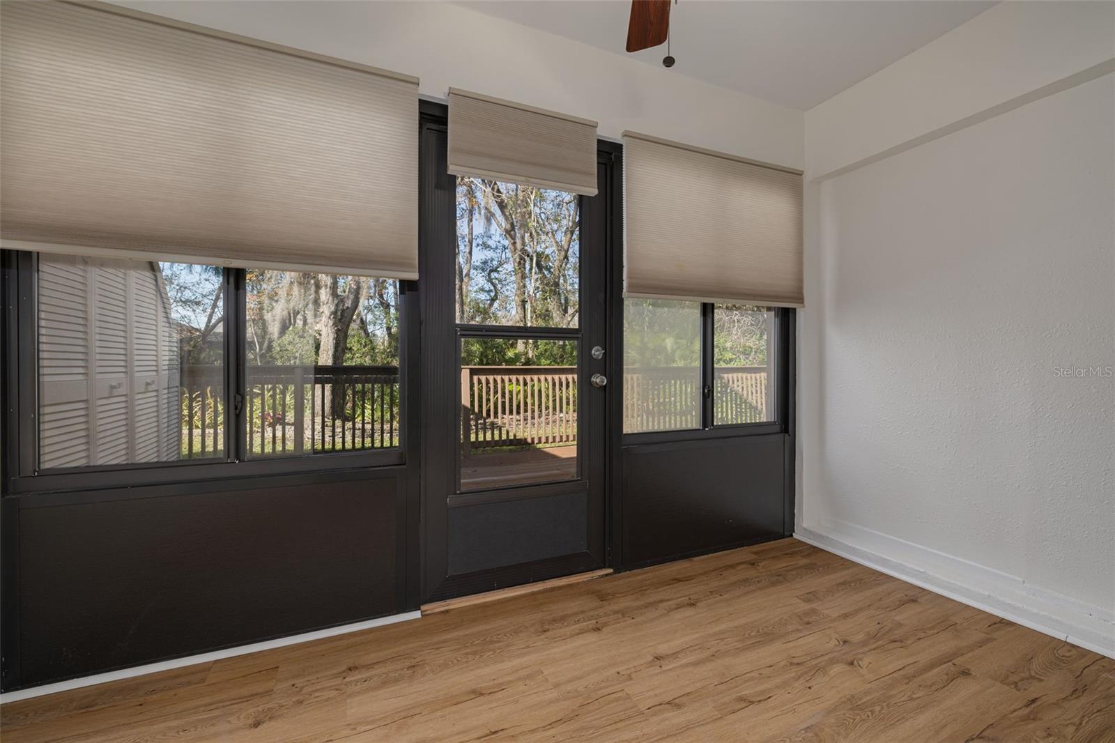 Private sunroom with a storage closet, windows and screens!