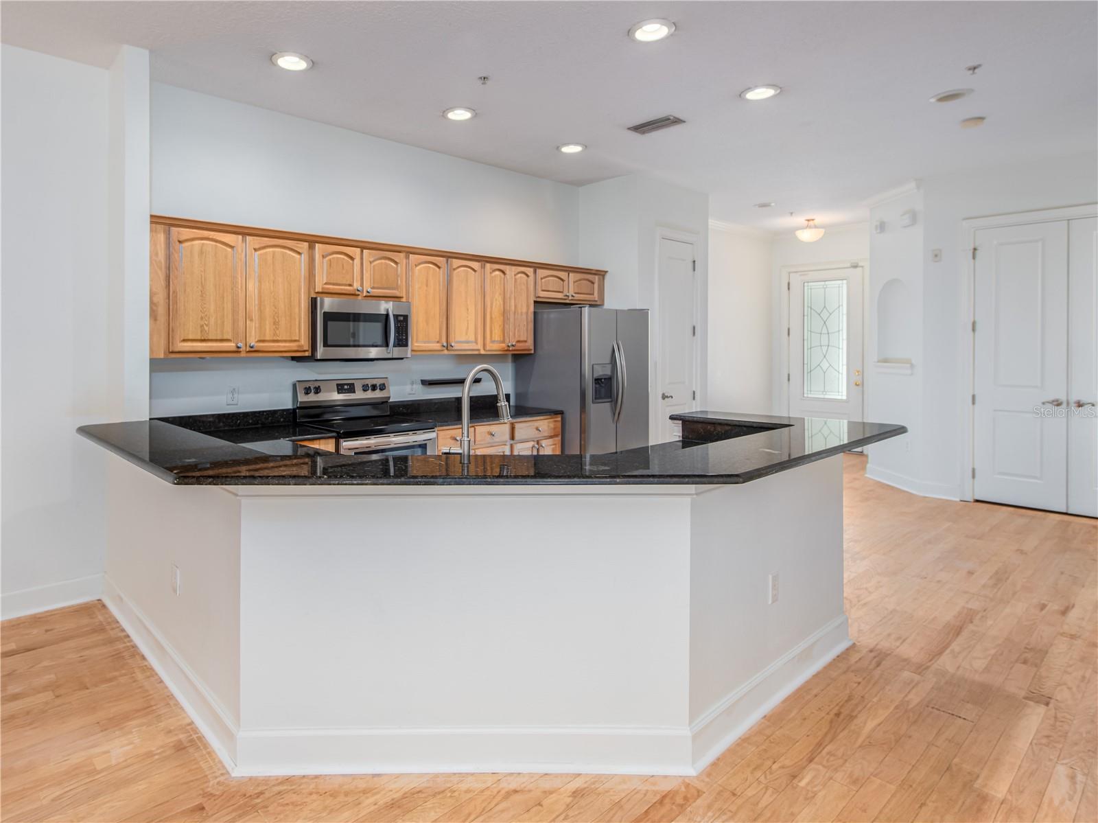 Large kitchen with granite countertops