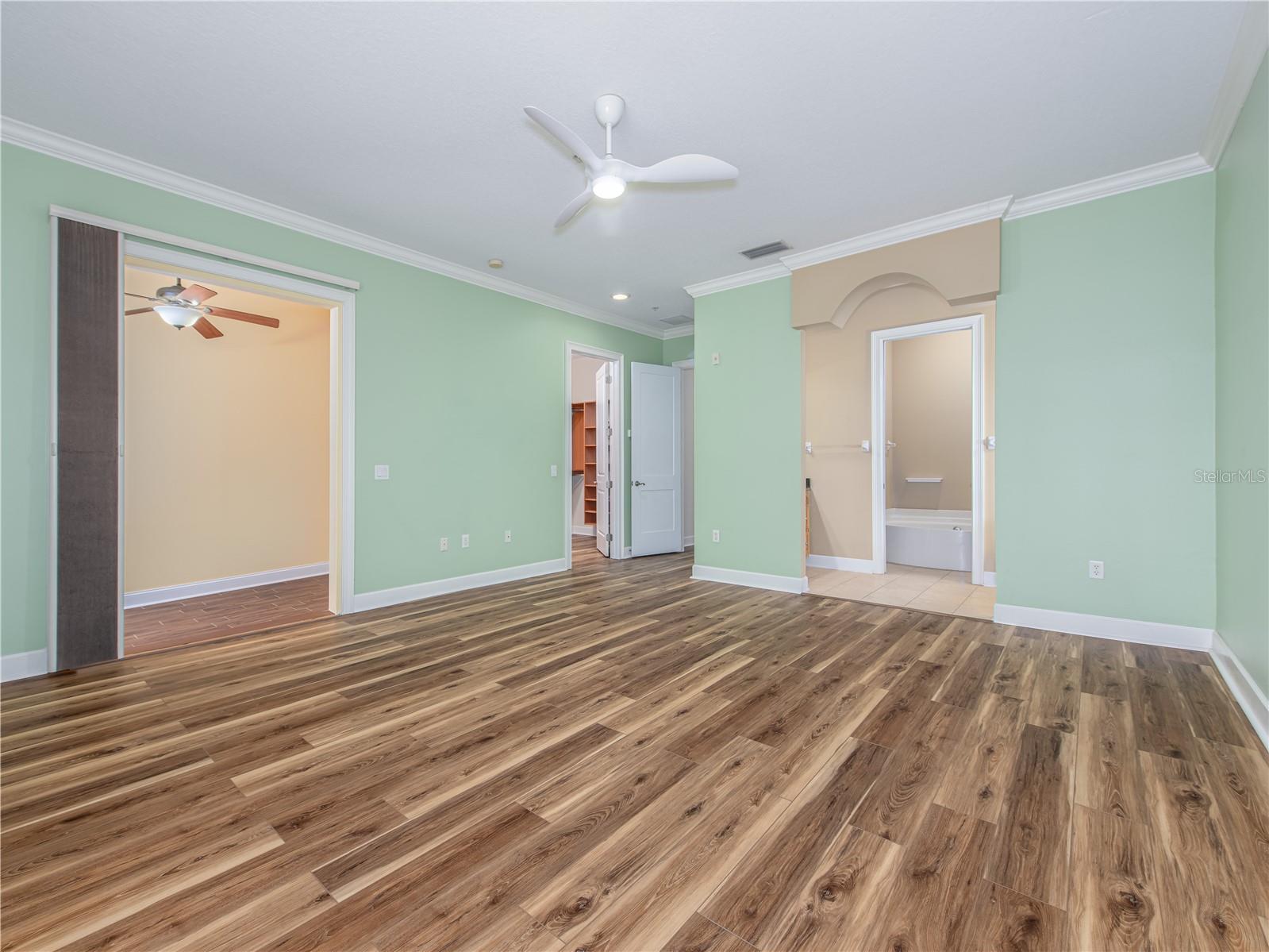 Primary bedroom looking towards the bonus room & ensuite bathroom