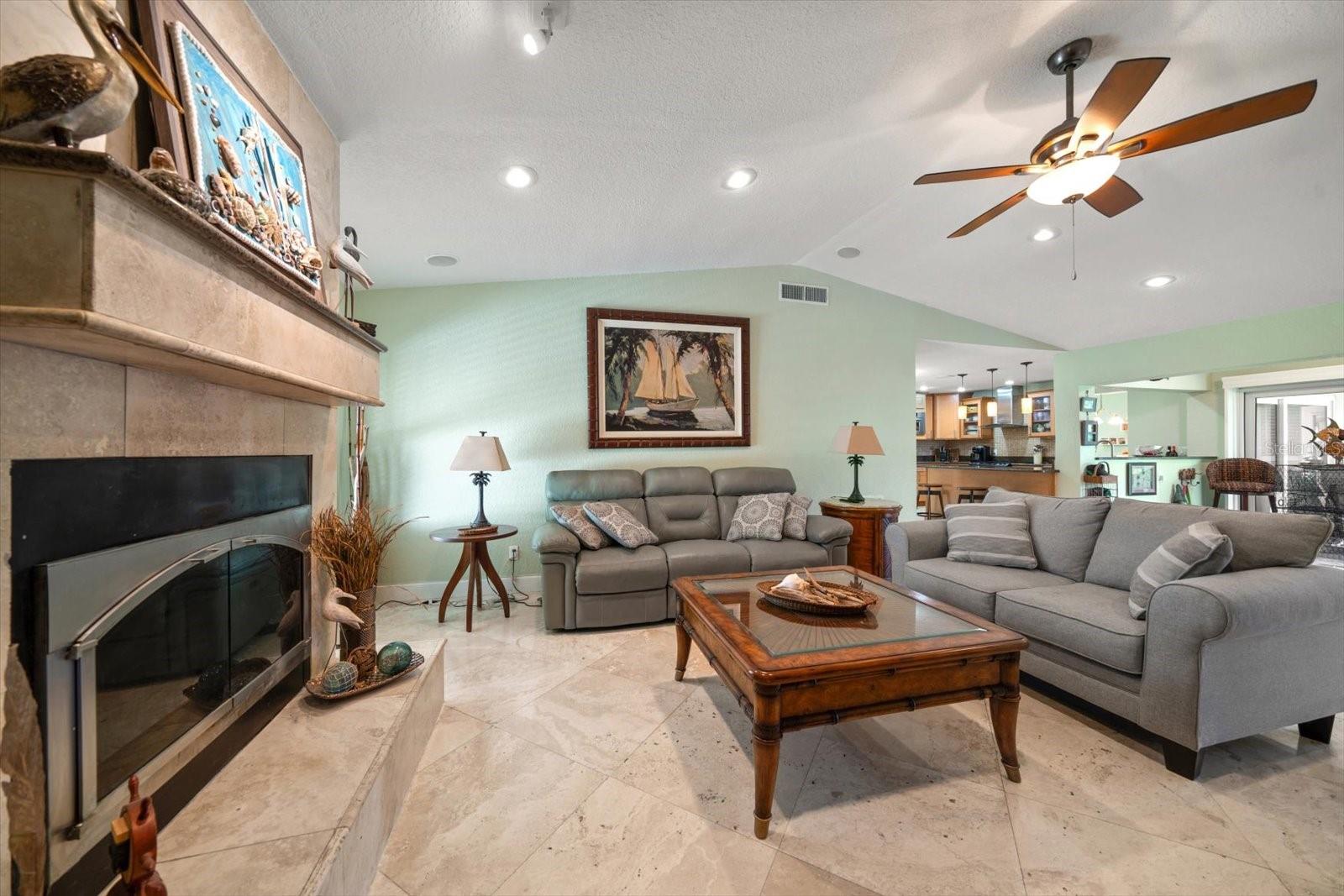 Cozy up in front of the wood-burning fireplace with stunning stone work surrounding it.