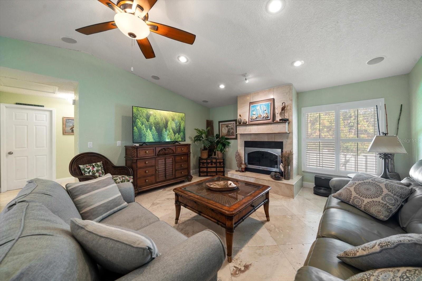 Make movie night an unforgettable experience in this expansive family room complete with built-in speakers to really amplify those climactic moments!