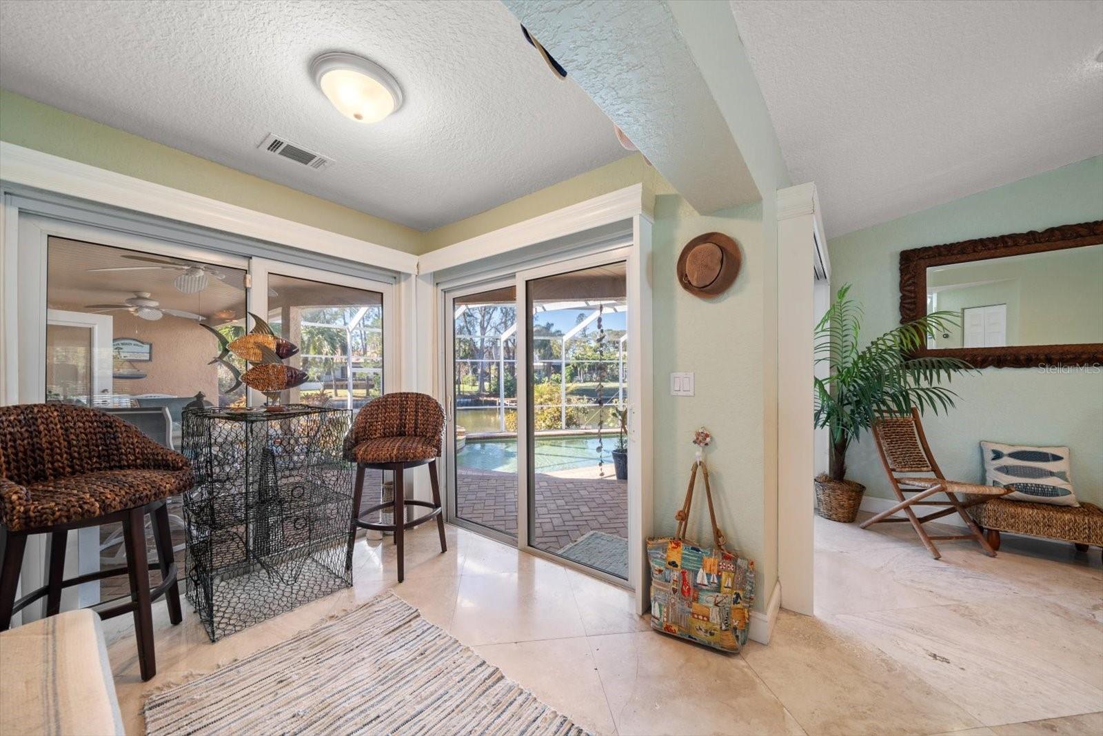 Start your day off right while enjoying breakfast in the cozy nook off of the kitchen, overlooking the pool and waterfront.