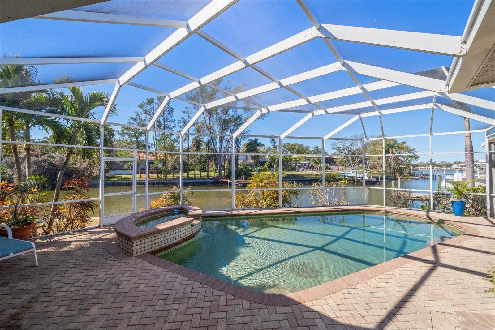 Imagine spending summer days lounging poolside in the serene and spacious outdoor living area, all while soaking in the stunning open water views.