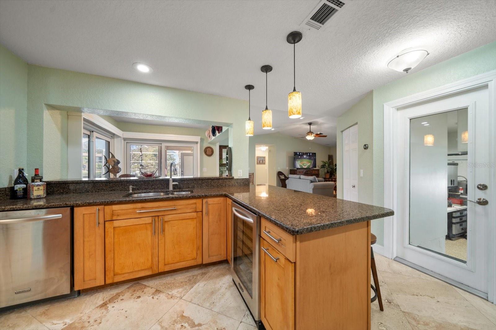 Cooking will be a breeze with so much space on the beautiful stone countertops.