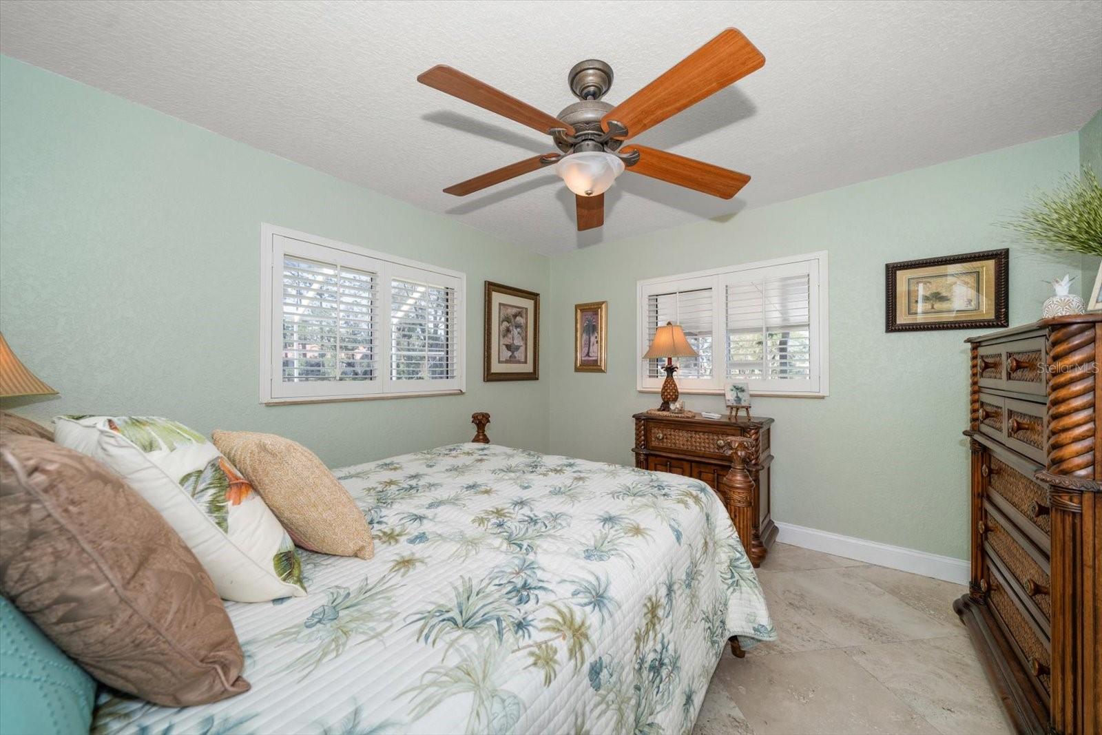 Guest bedroom number 3, overlooking the pool and waterfront.