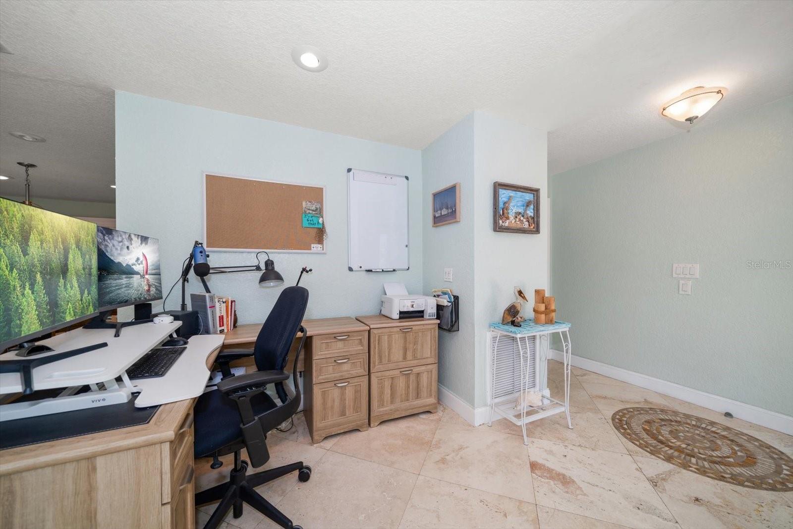 Areas of flexible use are found throughout the home, such as this area off of the living room used as an office space.