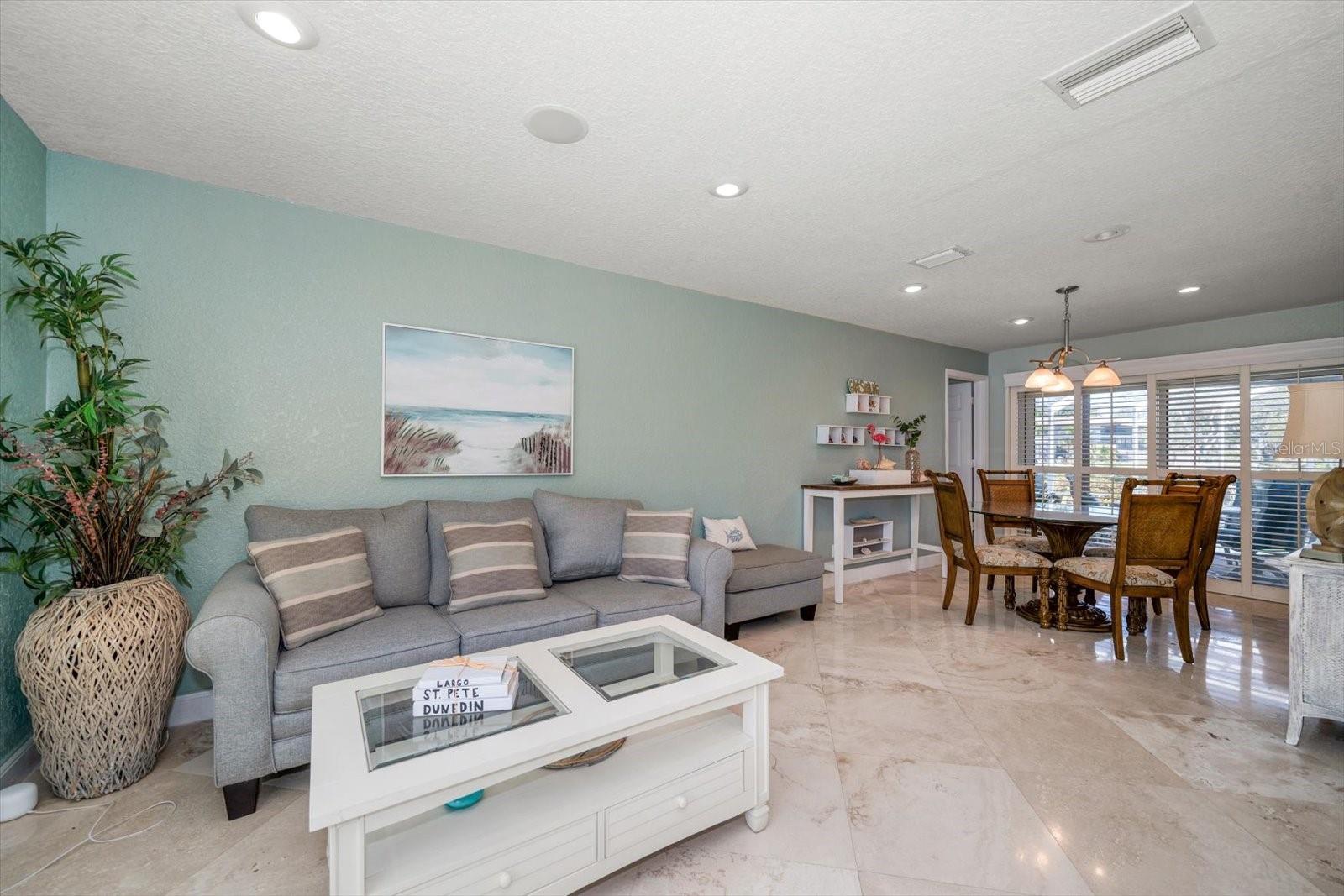 The formal living and dining areas provide a perfect welcome to you and your guests. The large sliders off of the dining room invite lots of natural light and gorgeous waterfront views.