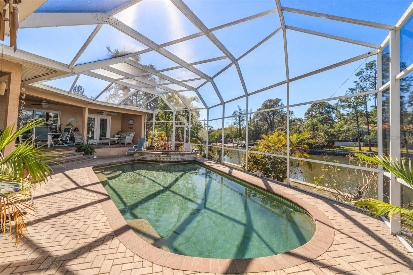 Enjoy less maintenance throughout the year with the expansive birdcage covering surrounding the pool area.
