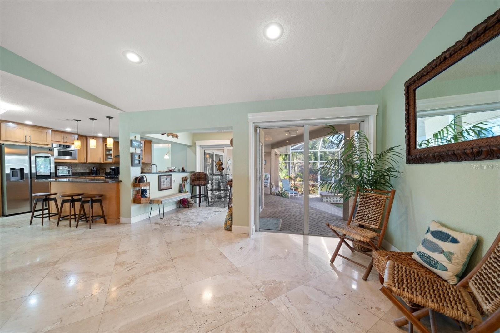 The great room opens up to the kitchen, breakfast nook, and the outdoor living spaces, making it the perfect place to gather and entertain.