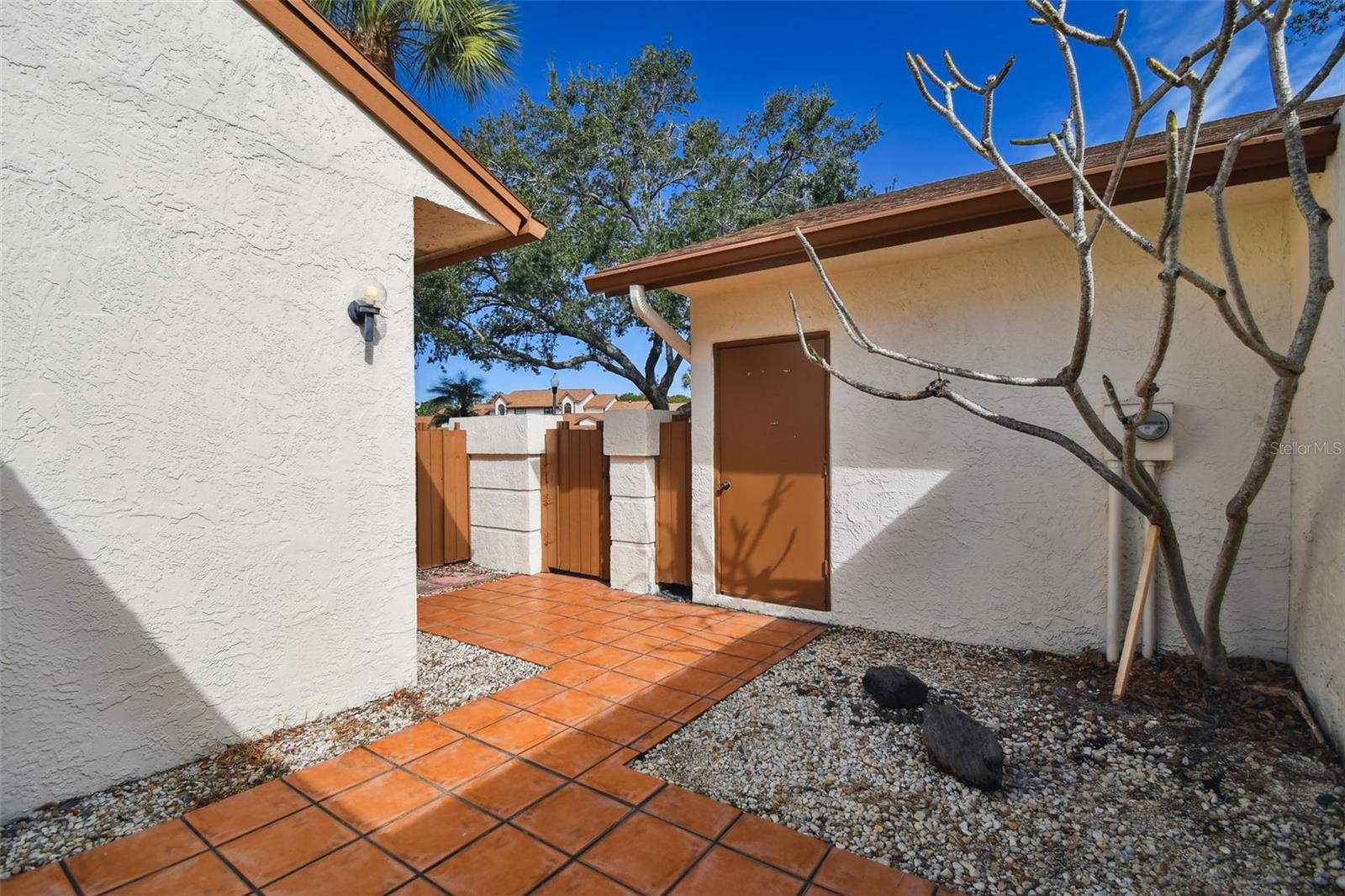 Front courtyard entry with private garage access