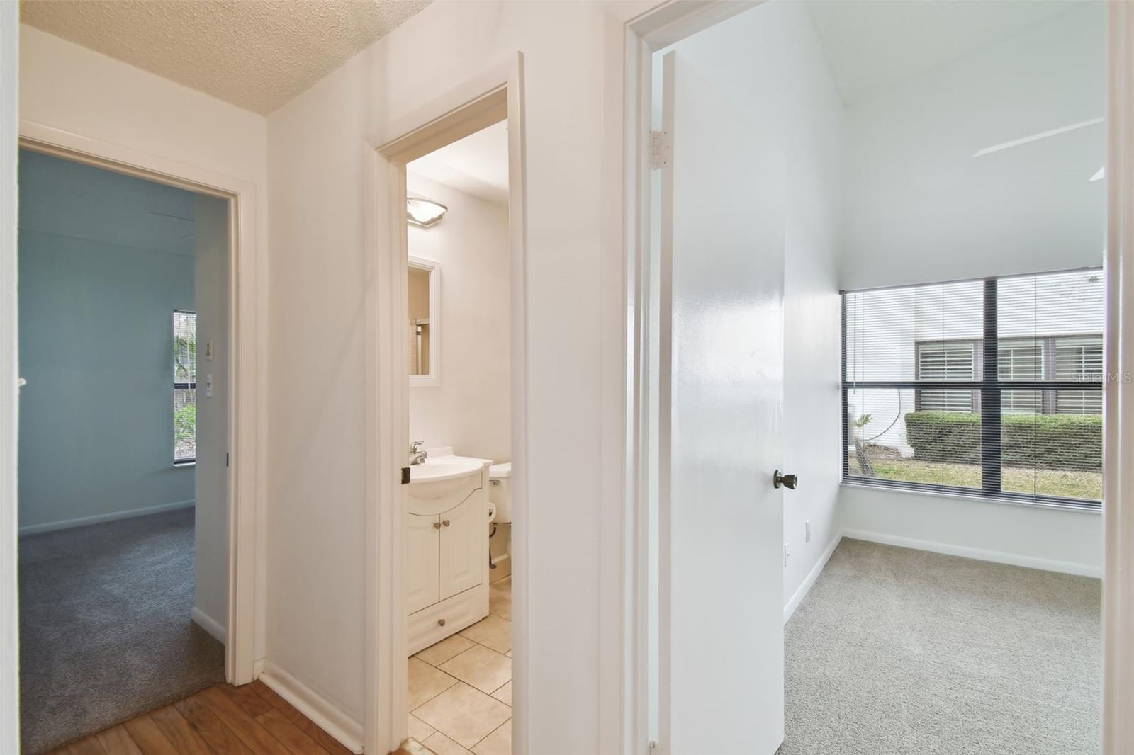 Guest bedrooms & bath are privately located on a hallway off the living space